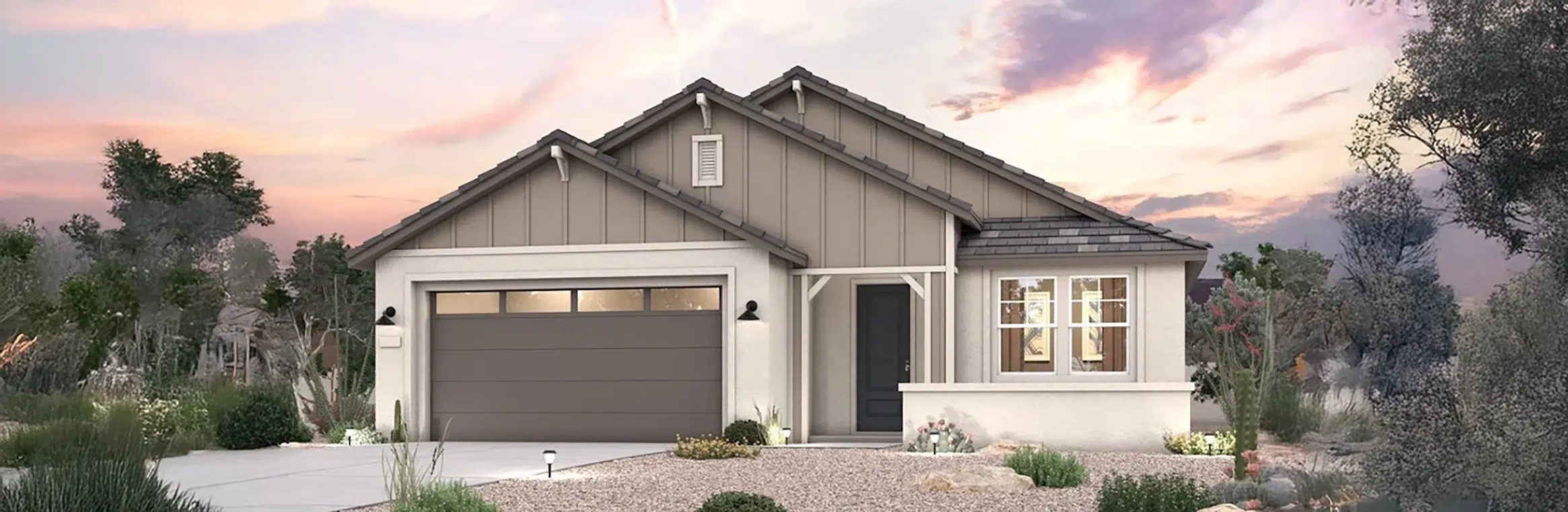 Single-story modern house with gray siding, a two-car garage, covered entryway, and desert landscaping at sunset.