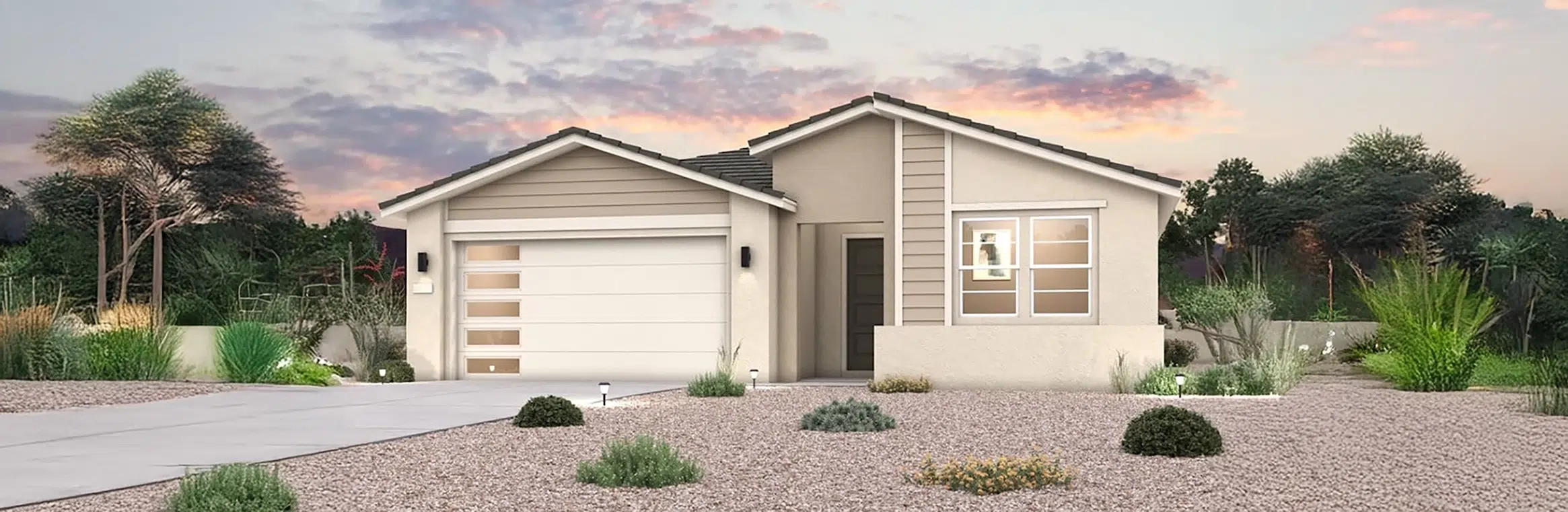 Single-story modern house with a two-car garage, large windows, beige exterior, and xeriscaped front yard featuring rocks and drought-tolerant plants at sunset.
