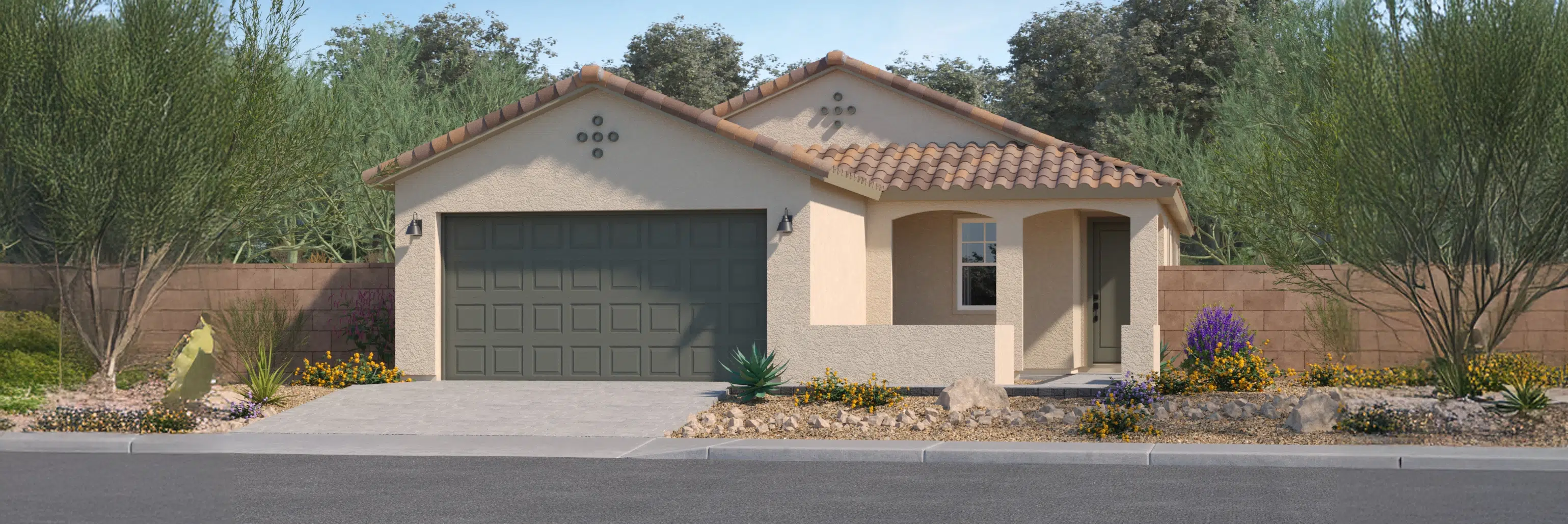 Single-story house with a two-car garage, tan stucco exterior, red-tiled roof, and desert landscaping in the front yard.