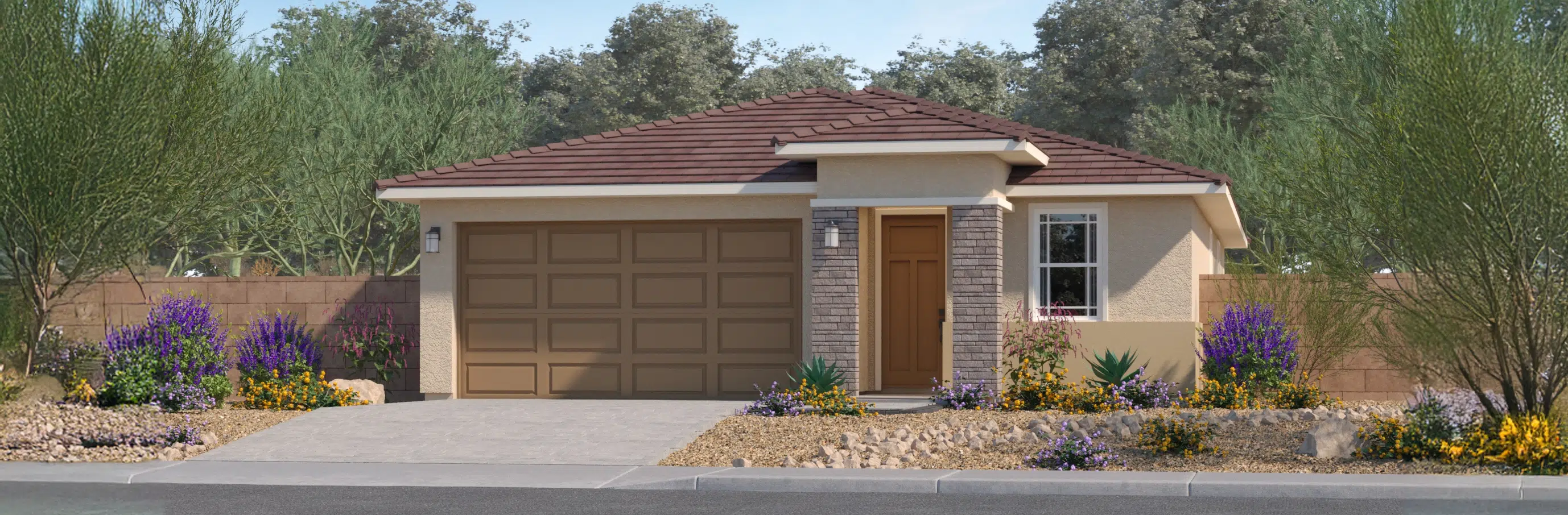 Single-story house with a brown garage door, tan walls, a small front porch, and desert landscaping featuring rocks and flowering plants.
