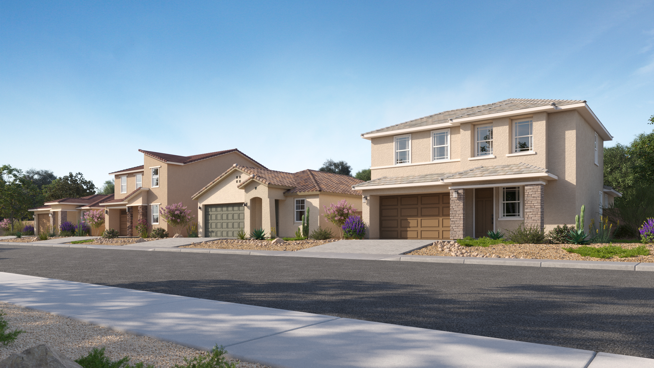 A row of modern suburban two-story houses with garages, landscaped front yards, and a quiet street under a clear blue sky.