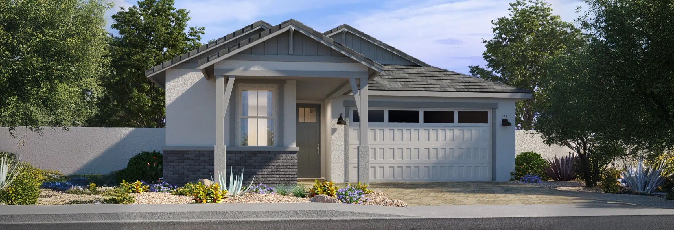 Single-story suburban house with a front porch, attached two-car garage, landscaped yard, and a mix of shrubs and desert plants.