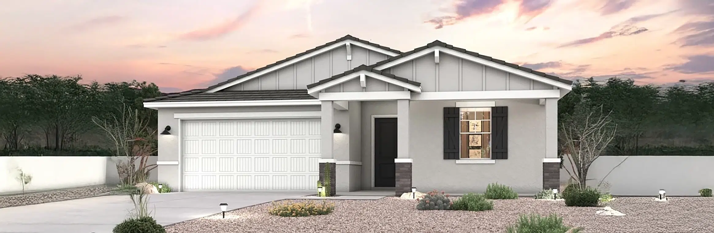 Single-story modern house with a two-car garage, white and gray exterior, front porch, desert landscaping, and a sunset sky in the background.