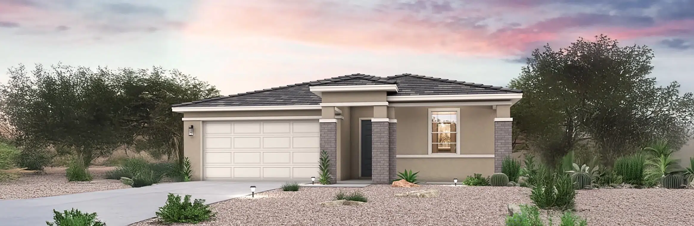 Single-story house with a two-car garage, desert landscaping, and a sunset sky in the background.
