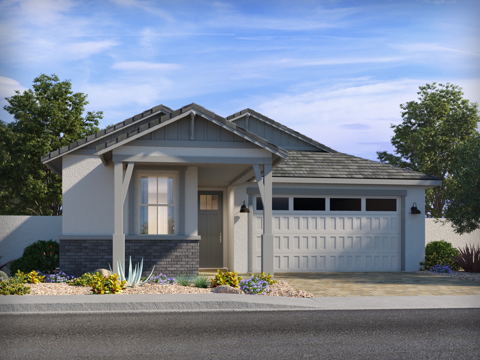 Single-story suburban house with a front porch, two-car garage, landscaped yard, and gray roof under a blue sky.