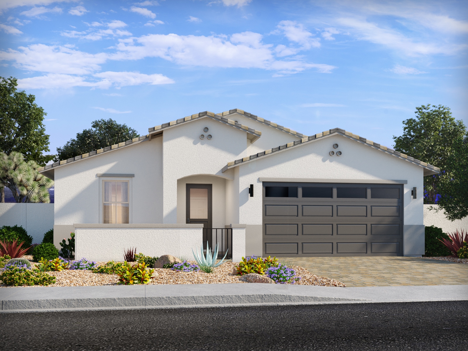 Single-story modern house with white stucco exterior, tile roof, double garage, desert landscaping, and clear blue sky.