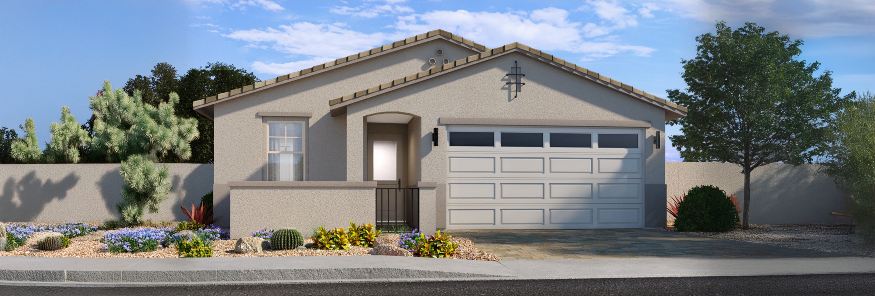 Single-story suburban house with a two-car garage, desert landscaping, and light beige exterior under a blue sky.