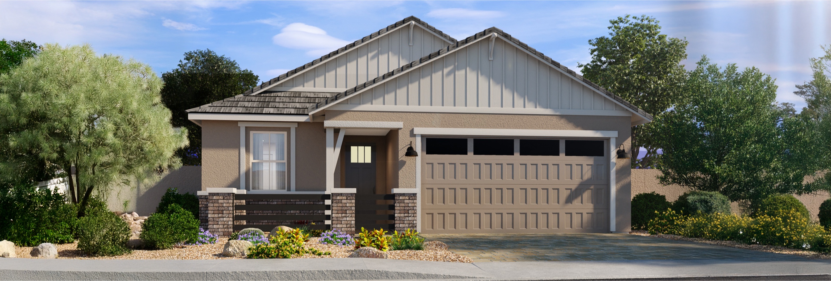 Single-story suburban house with a two-car garage, light tan exterior, gable roof, small front porch, and desert landscaping with rocks and shrubs.