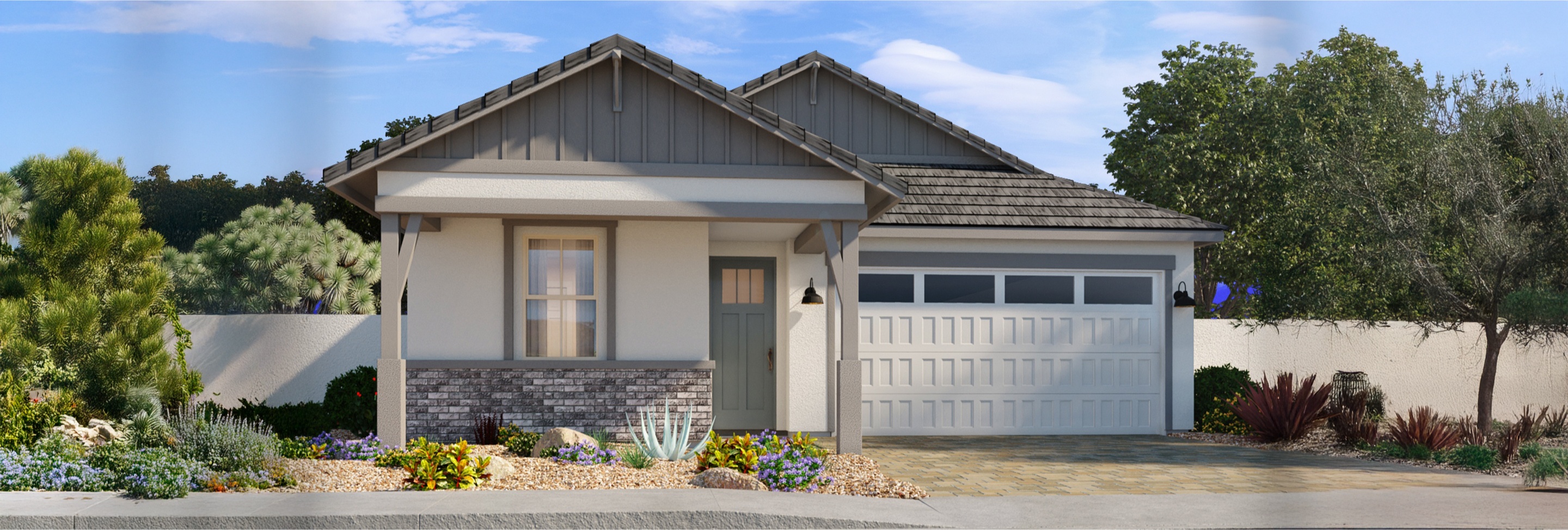 Single-story house with a front porch, brick accents, two-car garage, and desert landscaping under a blue sky.