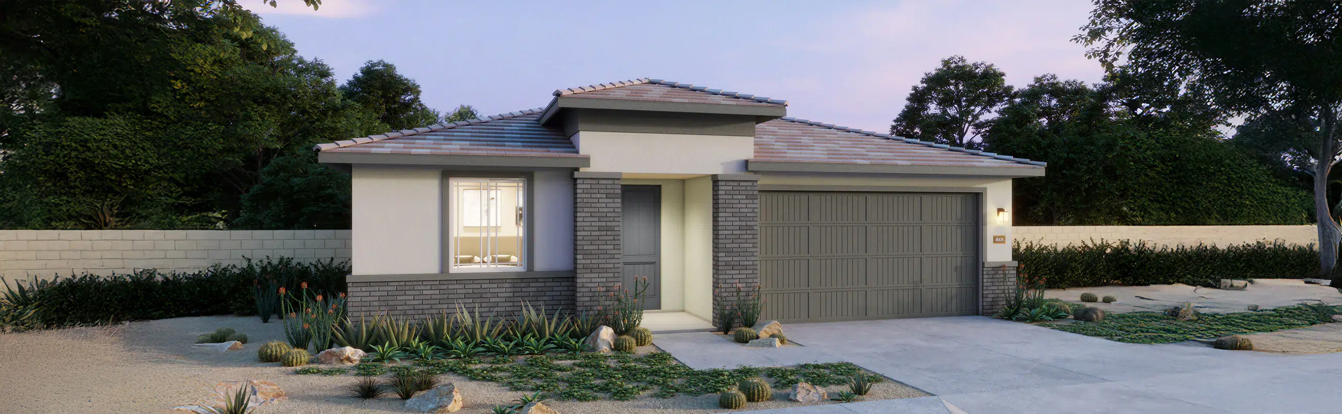 Single-story modern house with a gray tiled roof, double garage, large front window, and desert landscaping in the front yard.