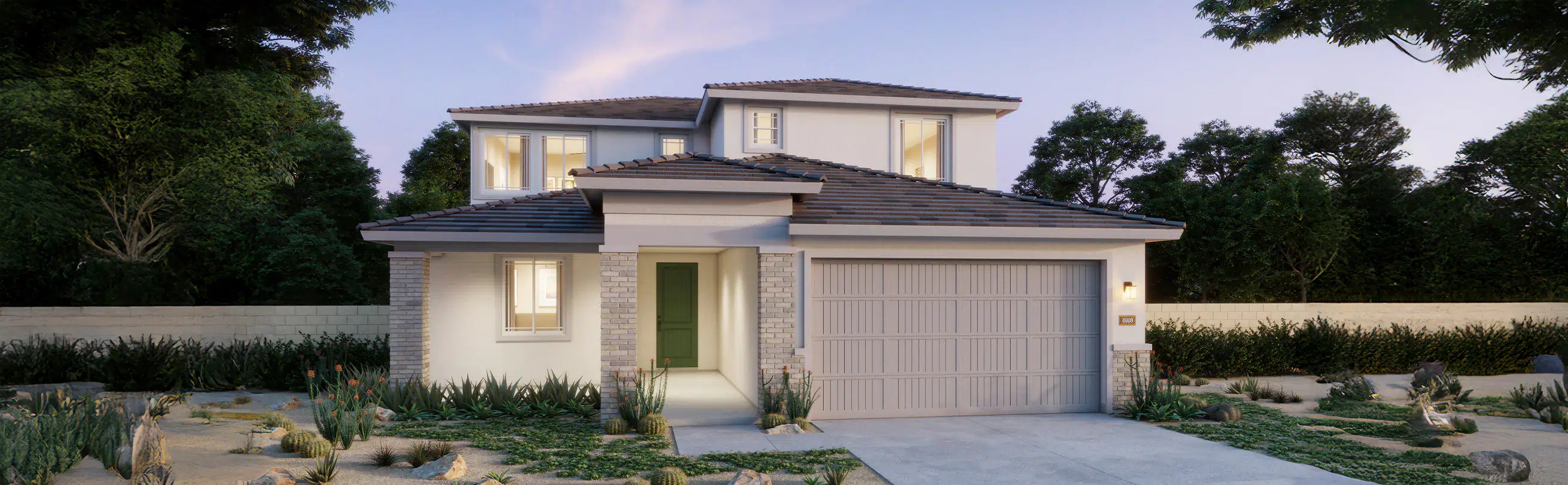 Two-story modern suburban house with white exterior, brick accents, and a double garage, surrounded by landscaping and trees at dusk.