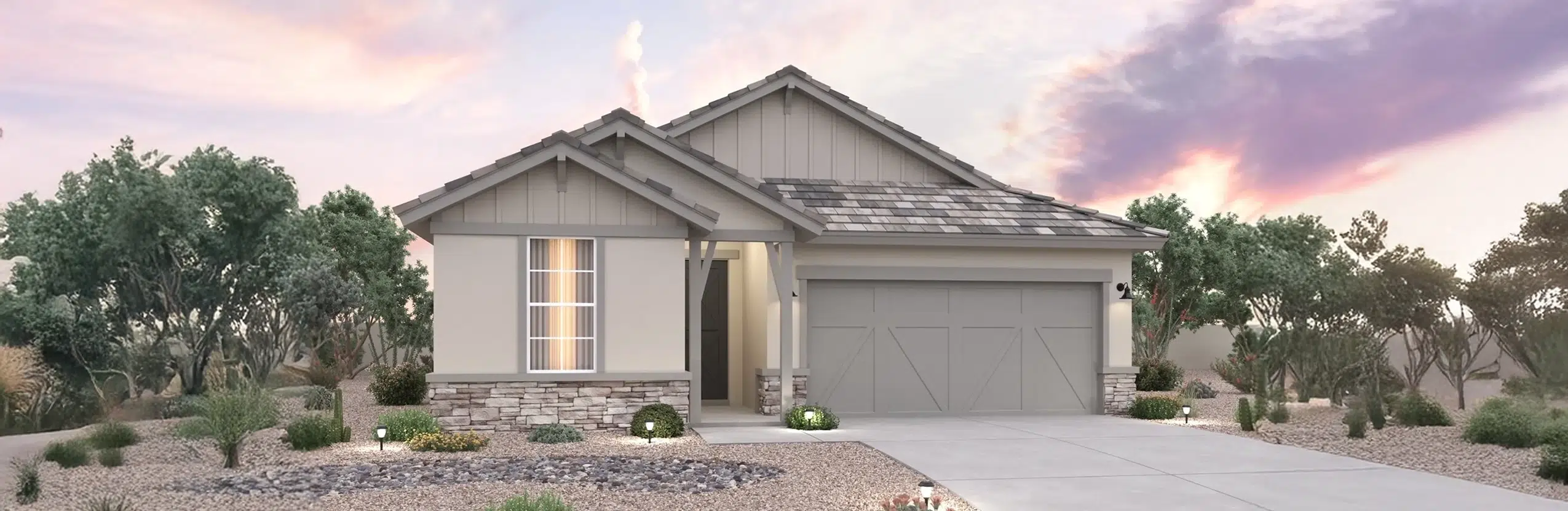 Single-story modern house with a two-car garage, stone accents, desert landscaping, and a concrete driveway, set against a sunset sky.